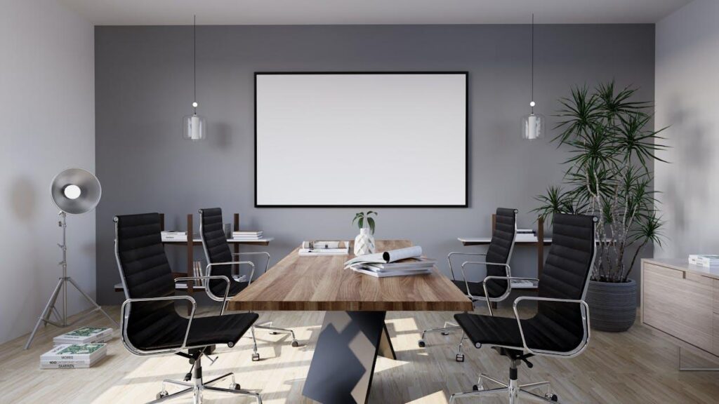 Free A modern conference room with a large screen Stock Photo