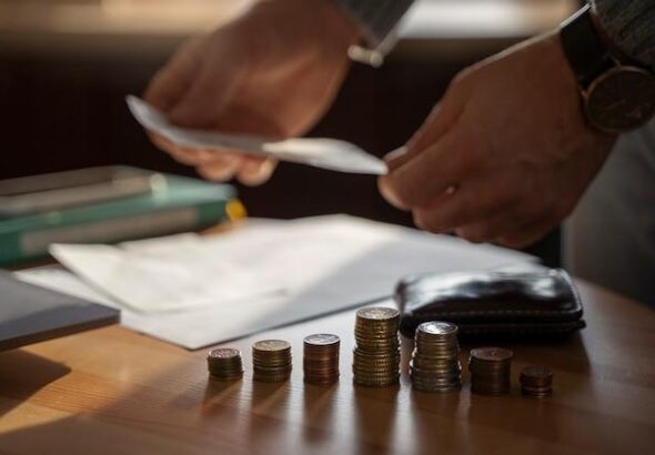 Close up on coins saved for energy crisis expenses